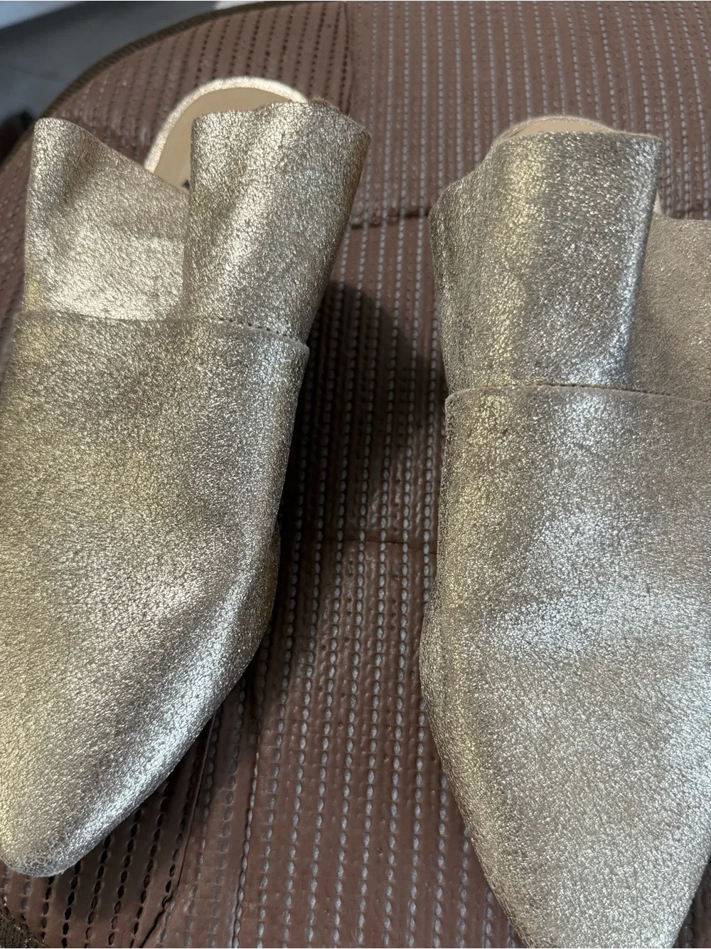 Free People metallic gold pointed-toe mule.